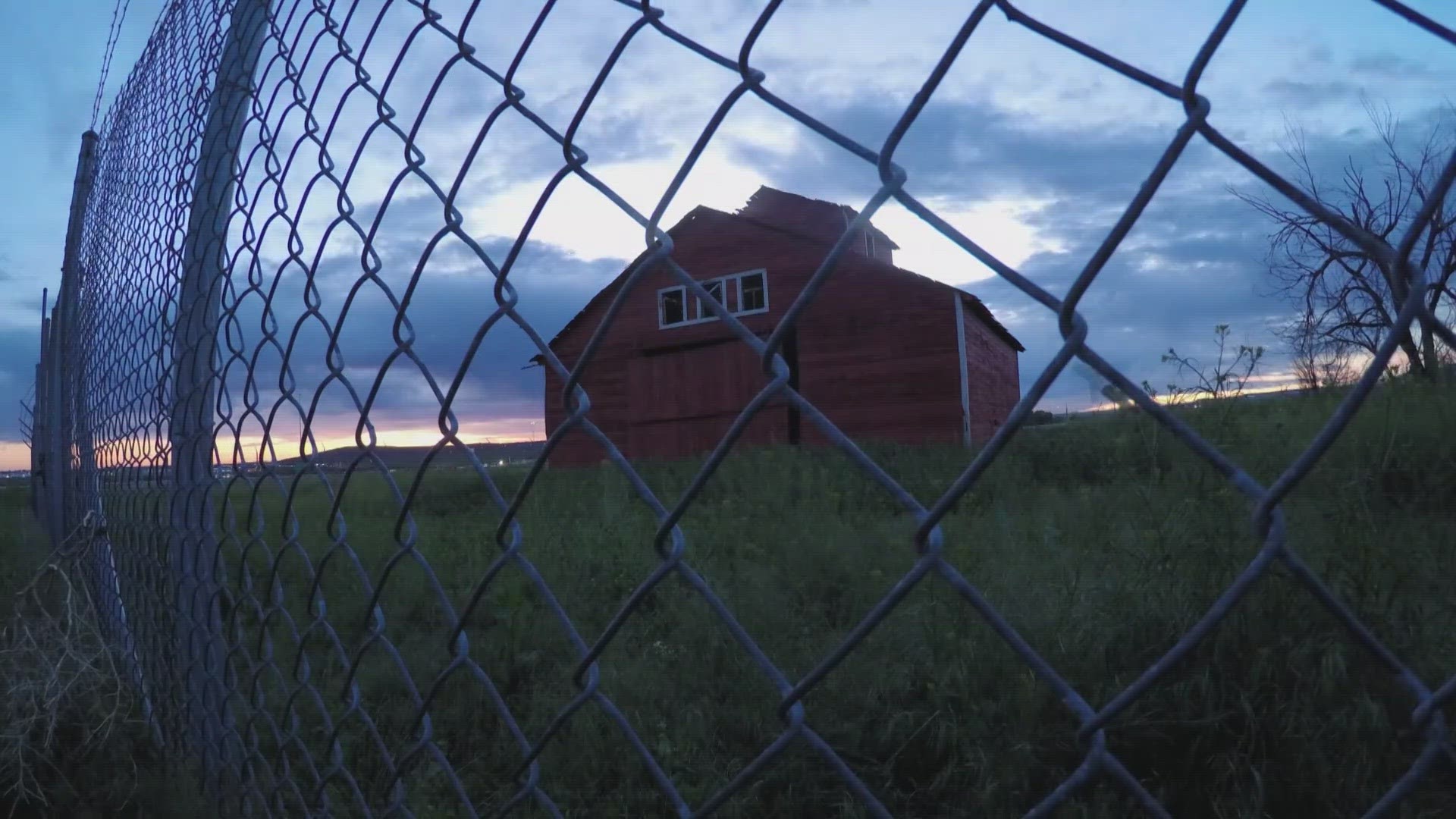An old red barn by Denver’s bustling airport scene has managed to remain standing since the early 1900s.